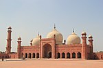 Front view of a Mughal-style mosque in red stone