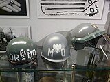 The wz. 67 helmet (mid) in painting for Milicja Obywatelska.