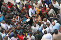 Image 39Photo and broadcast journalists interviewing government official after a building collapse (from Broadcast journalism)