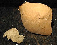 Broken ostracon from the Ai-Khanoum treasury, displaying inscription.