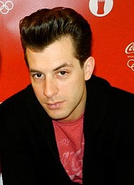 Mark Ronson wearing red T-shirt with a black jacket.