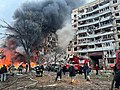 Firefighters putting out a fire at a residential building on Sobornyi District's Naberezhna Peremohy St [uk], 118, on 14 January 2023 after it was destroyed by a Russian Kh-22 missile