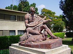 Shepard David playing the harp, in kibbutz Ramat David