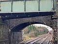 Hindley station view of two bridges and pipe from platform