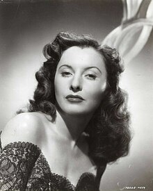 Portrait of Barbara Stanwyck by Whitey Schafer, October 1944. Her shining shoulders are likely the result of canned sex.