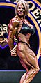 Aleesha Young doing a side triceps pose at the 2017 Rising Phoenix World Championships.