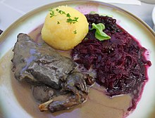 Wild hare leg with dumpling and red cabbage