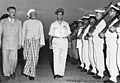 Moshe Sharett, U Nu, and Moshe Dayan at the Lod Airport in 1955.