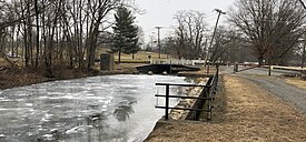 Parking area, lock, spillway and trail of the Delaware and Raritan Canal State Park, Ewing Township, NJ