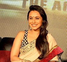 Rani Mukerji is smiling away from the camera