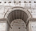 Lateral arched opening between the main arch and a side archway