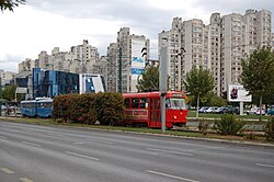 Tram in front of the neighbourhood's residential buildings