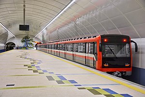 A train departing from the State University station