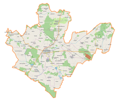 Mapa konturowa powiatu radzyńskiego, blisko centrum na lewo znajduje się punkt z opisem „Radzyń Podlaski”