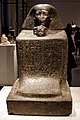 A block statue of Senenmut with the head of Hatshepsut's daughter Neferure appearing below his. From the Ägyptisches Museum, Berlin.