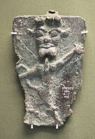 The front of a copper alloy Pazuzu amulet from the British Museum.