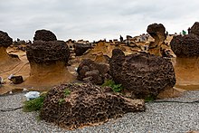 Light and dark brown rock formations in hoodoo shape