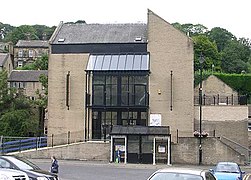 Former supermarket built spanning the River Holme