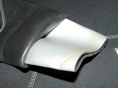 Neoprene cuff (of a wetsuit). Outer layer is single-sided neoprene; inner layer is double-sided.