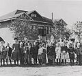 Students and teachers in front of the Little Red Schoolhouse, c. 1910.