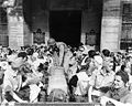 Army nurses climb into trucks leaving Santo Tomas, 12 February 1945