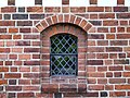 Herstedvester Kirke. Window in porch