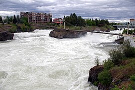 Outflow from the power plant visible on the right among the whitewater