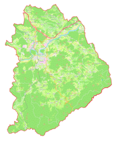 Mapa konturowa gminy miejskiej Novo mesto, blisko centrum na prawo u góry znajduje się punkt z opisem „Ratež”