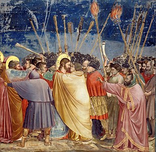 El Petó de Judes (1304–06) de Giotto di Bondone, va seguir la tradició medieval de vestir Judas Iscariote amb una túnica groga.