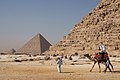 Image 43Tourists riding an Arabian camel in front of Pyramid of Khafre. The Giza Necropolis is one of Egypt's main tourist attractions. (from Egypt)