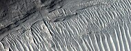 Close view of layers, as seen by HiRISE under HiWish program A ridge cuts across the layers at a right angle.