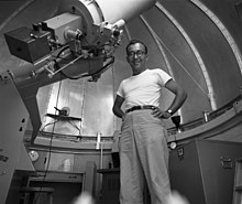 Landolt standing next to the Kitt Peak National Observatory's 16-inch telescope circa 1960