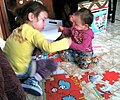 Image 11Girls assembling a puzzle (from Girls' toys and games)