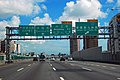 A group of green-coloured directional signs on the National Highway No. 1 in Kaohsiung, Taiwan