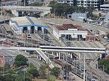 Long shot of train depot from a skyscraper