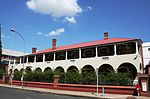 It is an imposing double-storey late nineteenth-century colonial building with a deep verandah. C J Rhodes, J B Robinson, Ernest Oppenheimer, Harry Oppenheimer, Lord Kitchener, Gen French, Field Marshal Montgomery, Duke of Connought, Prince of Wales Historical Interest "The original building of the Kimberley Club, which was founded in 1881, burnt down in 1886, as did its replacement in 1895. The present building, designed by the architect D. W. Greatbach, was completed in 1896. It was extended in 191x. Type of site: Club Current use: Social : Club. The original building of the Kimberley Club, which was founded in 1881, burnt down in 1886, as did its replacement in 1895. The present building, designed by the architect D W Greatbatch, was completed in 1896.