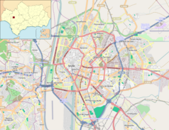 Mapa konturowa Sewilli, blisko centrum na lewo znajduje się punkt z opisem „Uniwersytet w Sewilli”