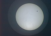 2004 transit as seen from Bangalore at 07:41 UTC, about two hours into the transit. The image is inverted compared to the diagram above, so Venus is seen near the top of the Sun's disc