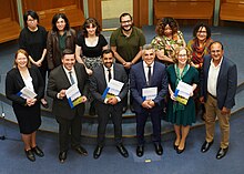 A group of people including the First Minister, Minister for Independence and Minister for Green Skills, Circular Circular Economy and Biodiversity hold 'Building A New Scotland' papers at its launch.