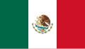 The flag of Mexico, a charged vertical triband.