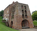 Moira Furnace with the furnace stack at the front and the bridgehouse building at the rear, originally there would have been a casting shed in front of the furnace where the iron 'pigs' were produced