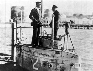 A view of U-2 showing her conning tower, two periscopes, and a ventilation mast (far left)