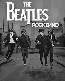 A black-and-white image, showing the four Beatles running in the foreground, against a block of buildings, styled with the game's logo and a grayscale starburst from the center