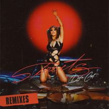 Cover art for the Remixes EP of "Streets": Doja Cat kneeling atop a car's smashed hood, her left hand raised to the air. A red sticker that says "REMIXES" is plastered on the cover art's bottom left corner.