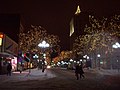 People walk along Main Street.