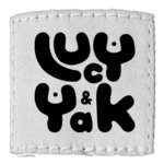 Lucy & Yak's logo, a white square patch with stitches round the side, with "Lucy & Yak" in a curvy and playful black font