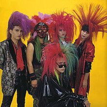 Promotional photo of Color. Dynamite Tommy is in front, with Marry, Toshi, Cindy and Tatsuya behind him.