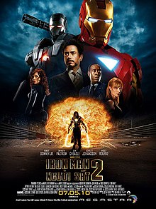 Tony Stark is pictured center wearing a smart suit, against a black background, behind him are is the Iron Man red and gold armor, and the Iron Man silver armor. His friends, Rhodes, Pepper, are beside him and below against a fireball appears Ivan Vanko armed with his energy whip weapons.