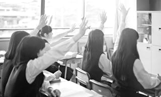 japanese-student-raising-their-hands-up-