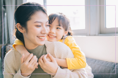 Asian mother and daughter at home together